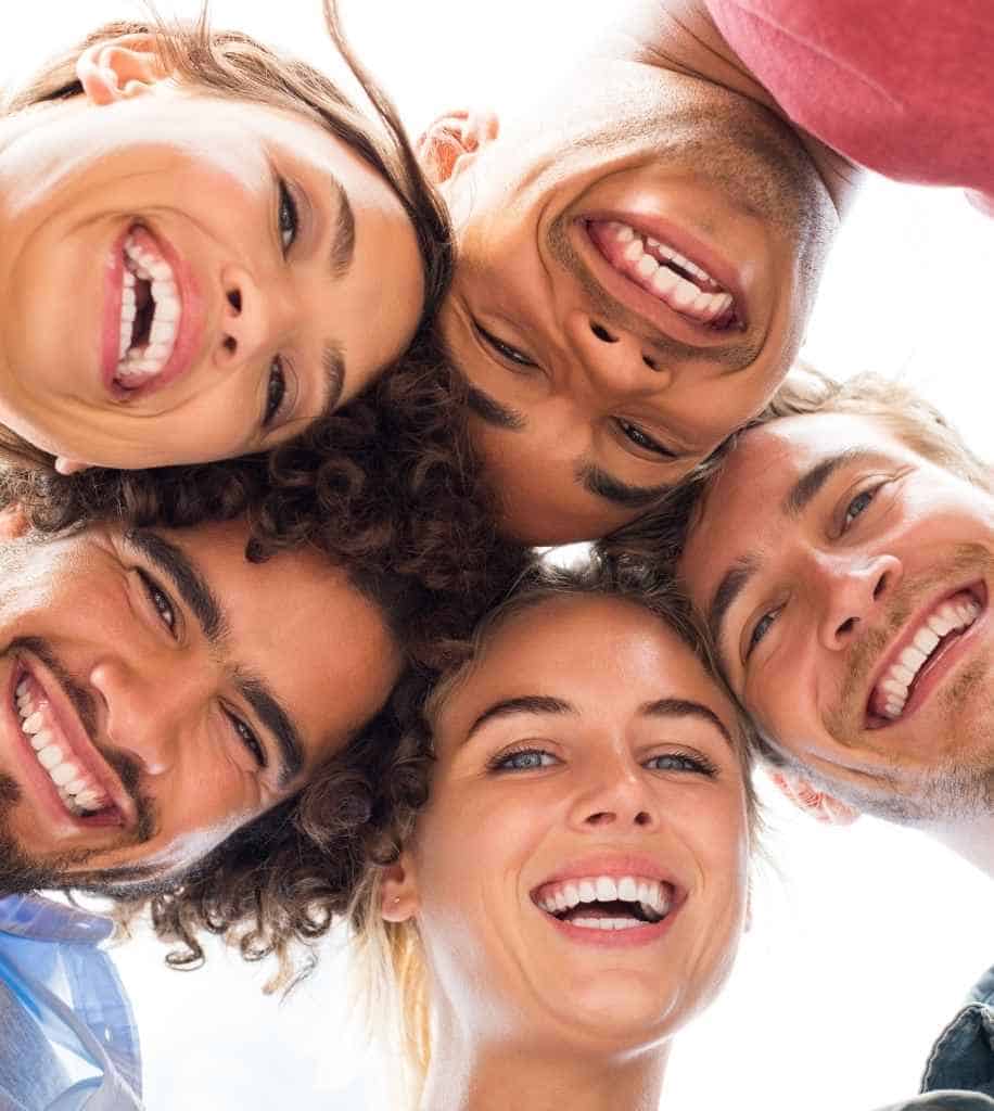 Smiling person showcasing white teeth after laser whitening treatment Sutton